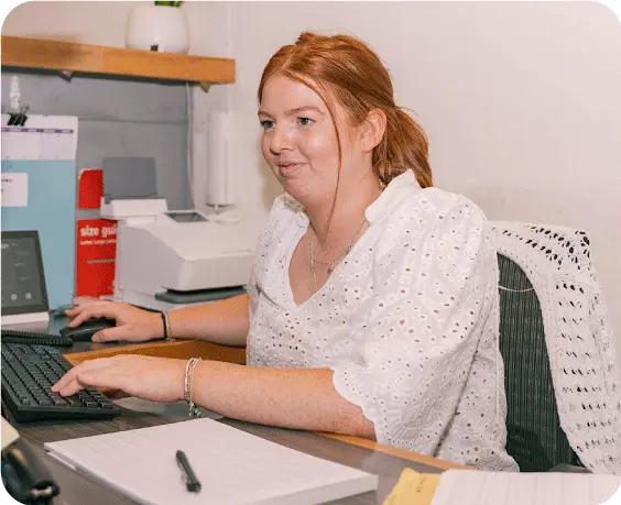 Georgina from Smethurst Accounting working at her desk - Rounded corner photograph